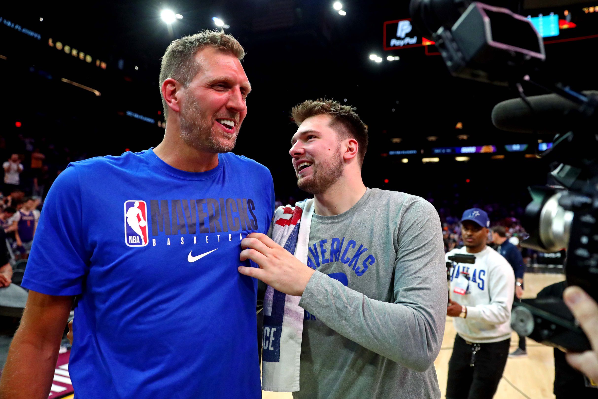 May 15, 2022; Phoenix, Arizona, USA; Dallas Mavericks guard Luka Doncic (77) greets former player Dirk Nowitzki after beating the Phoenix Suns in game seven of the second round for the 2022 NBA playoffs at Footprint Center. Mandatory Credit: Mark J. Rebilas-USA TODAY Sports
