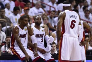 Jun 12, 2014; Miami, FL, USA; Miami Heat forward LeBron James (6) talks with center Chris Bosh (1), guard Dwyane Wade (3) during the second quarter of game four of the 2014 NBA Finals against the San Antonio Spurs at American Airlines Arena. Mandatory Credit: Bob Donnan-USA TODAY Sports