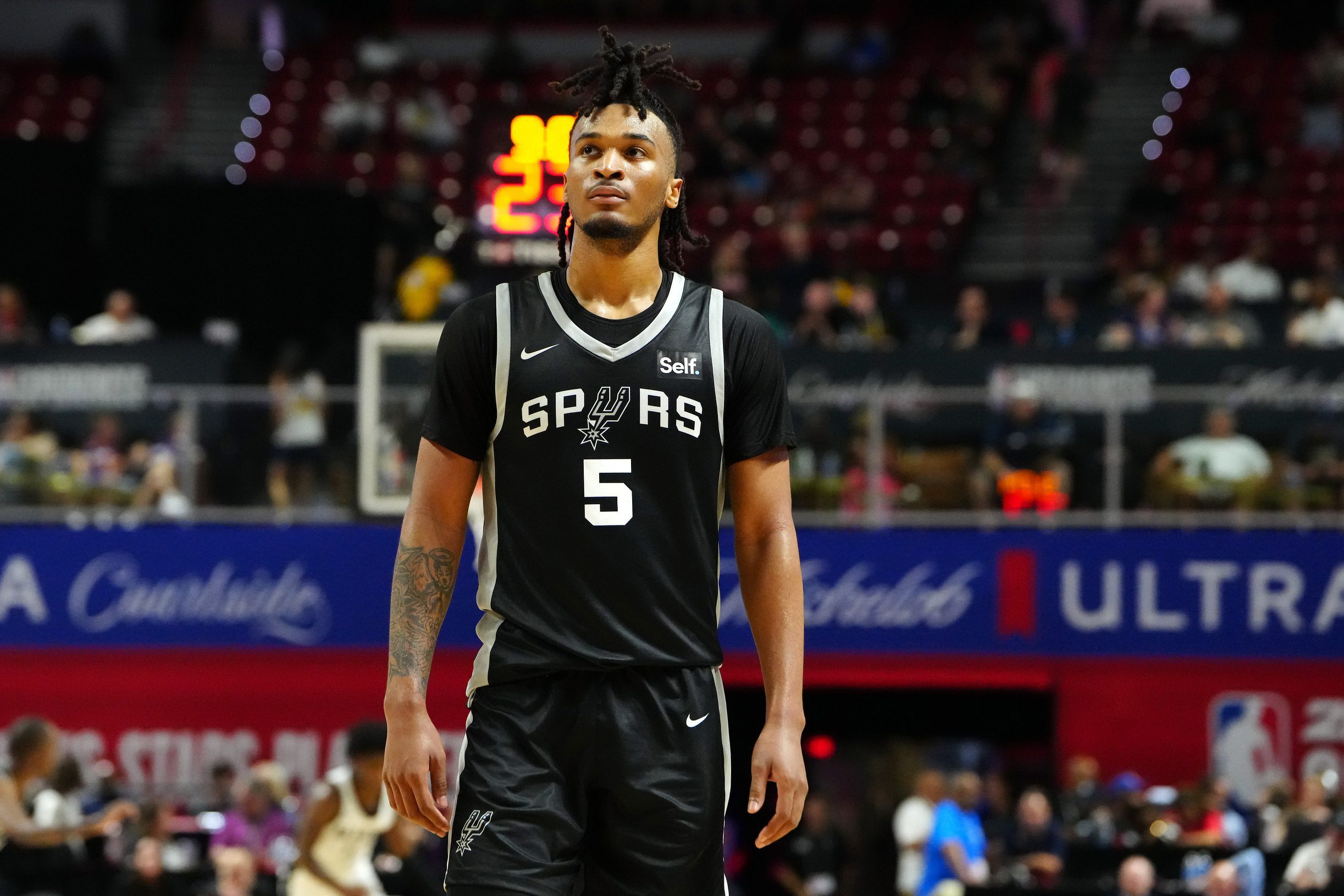 Jul 13, 2024; Las Vegas, NV, USA; San Antonio Spurs guard Stephon Castle (5) walks up court during the third quarter against the Portland Trail Blazers at Thomas & Mack Center. Mandatory Credit: Stephen R. Sylvanie-USA TODAY Sports