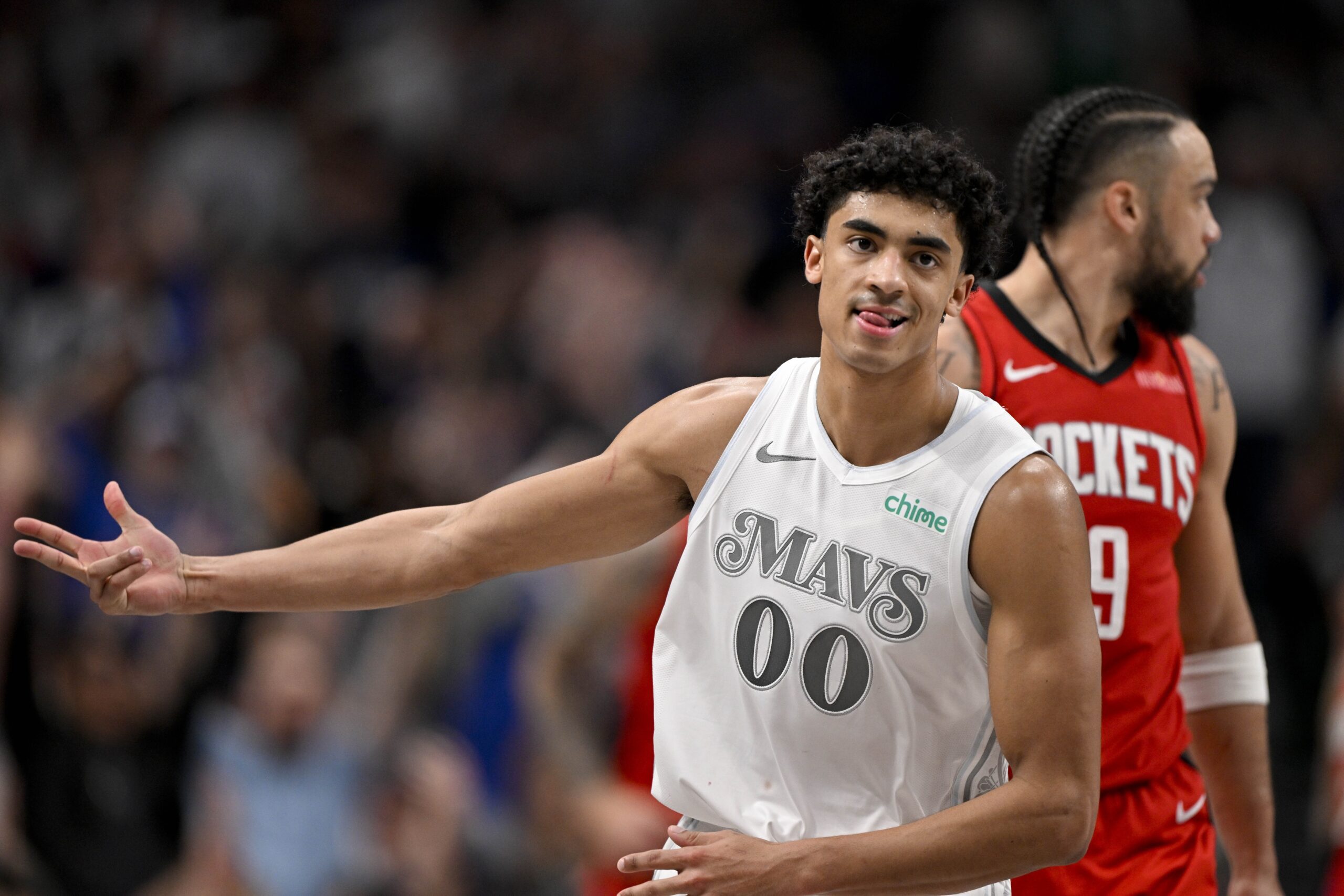 Dallas Mavericks guard Max Christie (00) celebrates making a three point basket during the game between the Dallas Mavericks and the Houston Rockets at the American Airlines Center