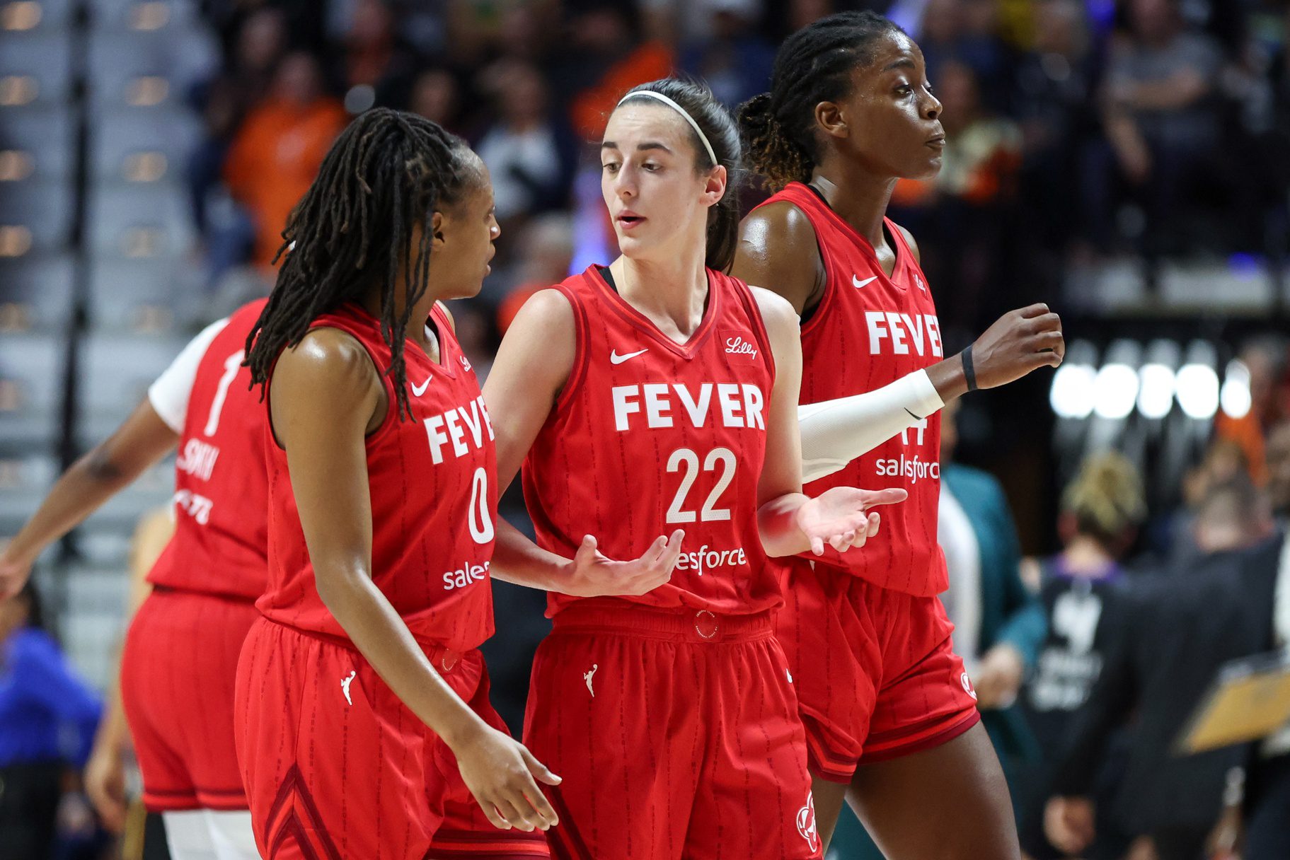 ndiana Fever guard Caitlin Clark (22) talks to Indiana Fever guard Kelsey Mitchell (0) during the first half during game two of the first round of the 2024 WNBA Playoffs at Mohegan Sun Arena.