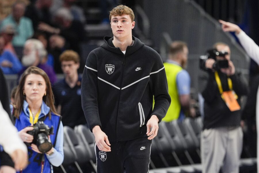 Duke Blue Devils forward Cooper Flagg (2) walks to the bench during the first half against the North Carolina Tar Heels at Spectrum Center. 