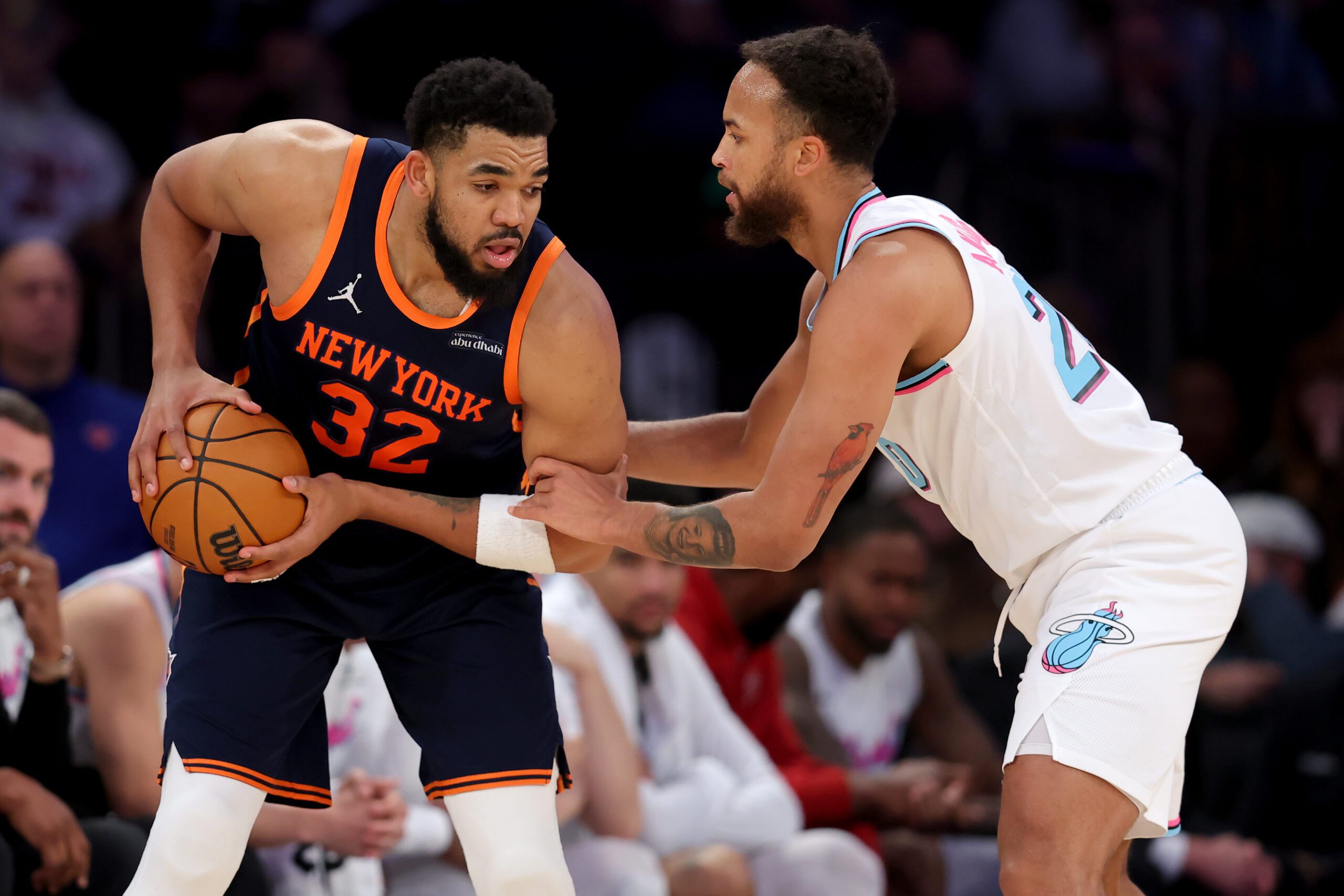 Mar 17, 2025; New York, New York, USA; New York Knicks center Karl-Anthony Towns (32) controls the ball against Miami Heat forward Kyle Anderson (20) during the fourth quarter at Madison Square Garden. Mandatory Credit: Brad Penner-Imagn Images