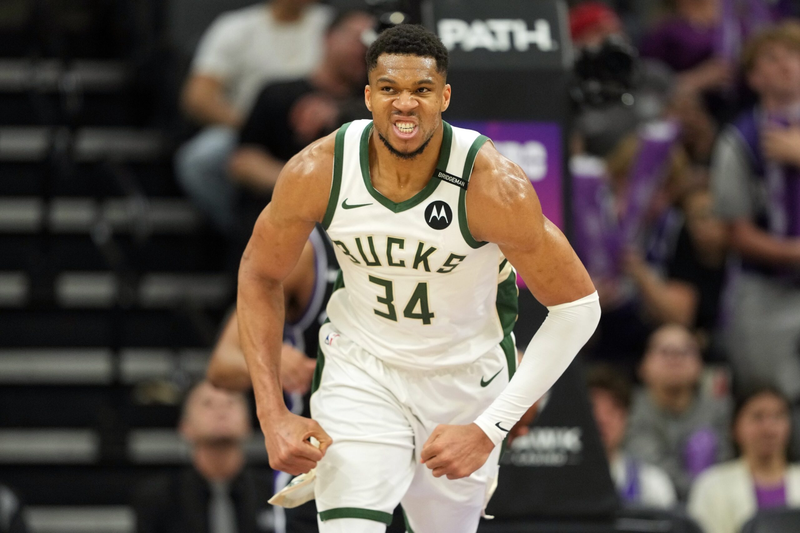 Milwaukee Bucks forward Giannis Antetokounmpo (34) reacts after scoring against the Sacramento Kings during the fourth quarter at Golden 1 Center
