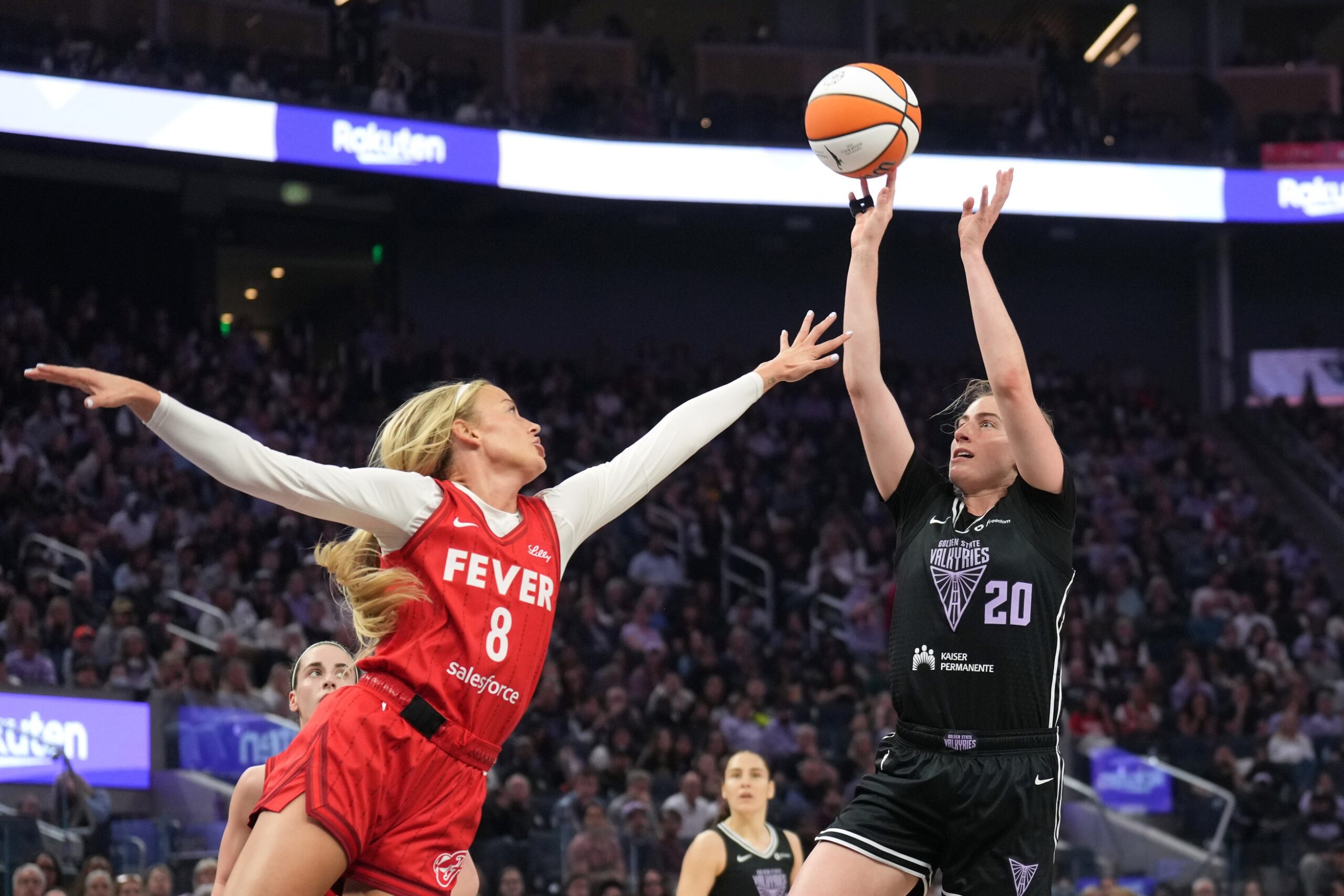 Golden State Valkyries guard Kate Martin (20) shoots against Indiana Fever guard Sophie Cunningham (8) during the second quarter at Chase Center