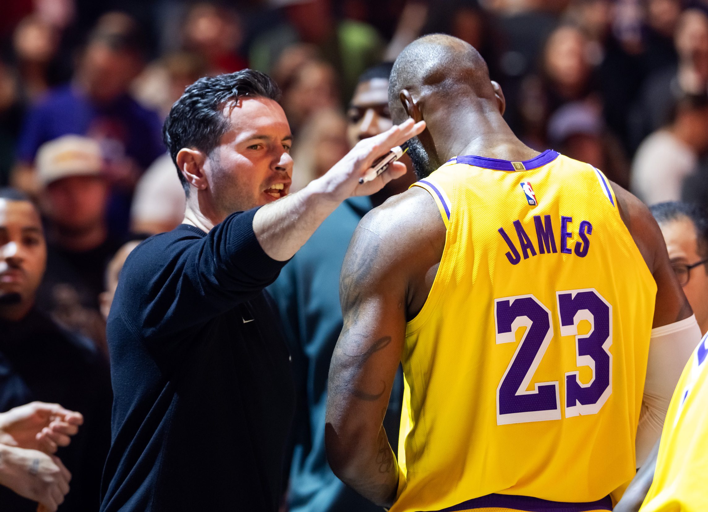 Dec 23, 2025; Phoenix, Arizona, USA; Los Angeles Lakers forward LeBron James (23) and head coach JJ Redick against the Phoenix Suns at Mortgage Matchup Center. Mandatory Credit: Mark J. Rebilas-Imagn Images