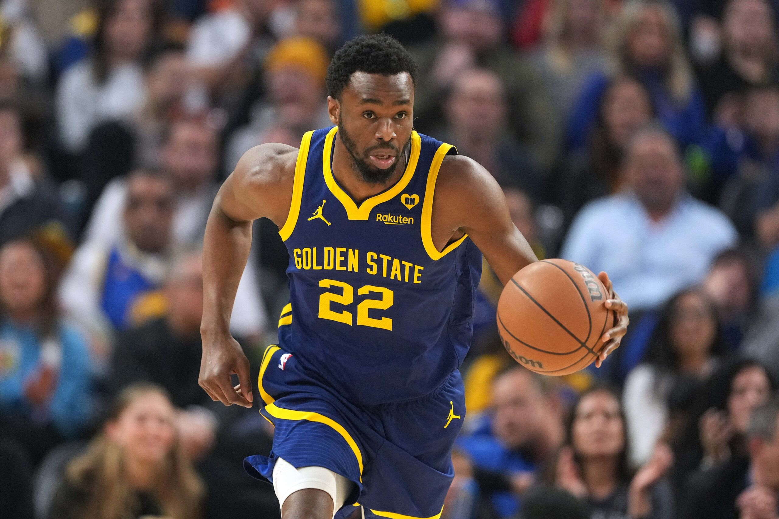 Feb 23, 2024; San Francisco, California, USA; Golden State Warriors forward Andrew Wiggins (22) dribbles against the Charlotte Hornets during the first quarter at Chase Center. Mandatory Credit: Darren Yamashita-USA TODAY Sports