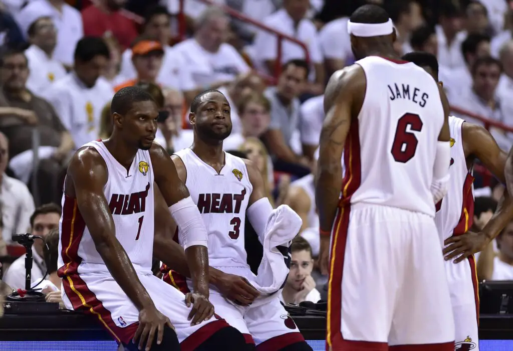 Jun 12, 2014; Miami, FL, USA; Miami Heat forward LeBron James (6) talks with center Chris Bosh (1), guard Dwyane Wade (3) during the second quarter of game four of the 2014 NBA Finals against the San Antonio Spurs at American Airlines Arena. Mandatory Credit: Bob Donnan-USA TODAY Sports