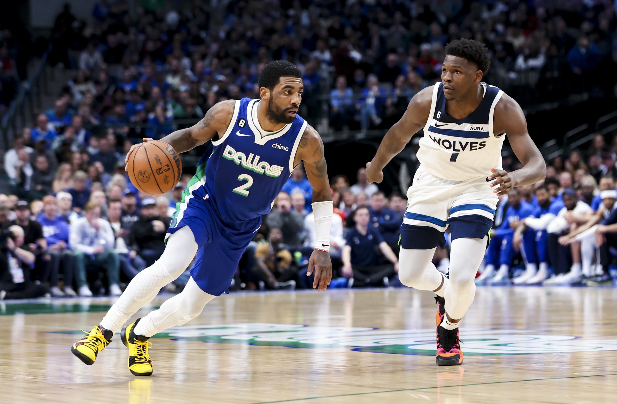 Feb 13, 2023; Dallas, Texas, USA; Dallas Mavericks guard Kyrie Irving (2) drives to the basket as Minnesota Timberwolves guard Anthony Edwards (1) defends during the fourth quarter at American Airlines Center. Mandatory Credit: Kevin Jairaj-USA TODAY Sports