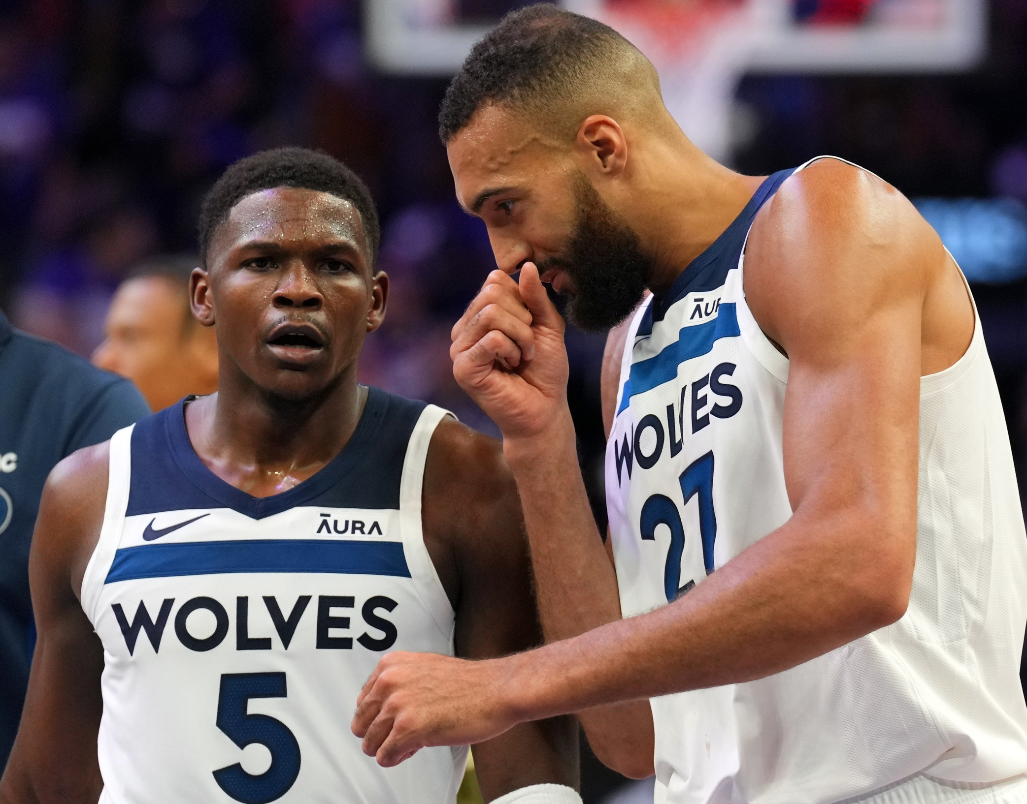 Apr 26, 2024; Phoenix, Arizona, USA; Minnesota Timberwolves guard Anthony Edwards (5) and Minnesota Timberwolves center Rudy Gobert (27) talk during the first half of game three of the first round for the 2024 NBA playoffs against the Phoenix Suns at Footprint Center. Mandatory Credit: Joe Camporeale-USA TODAY Sports