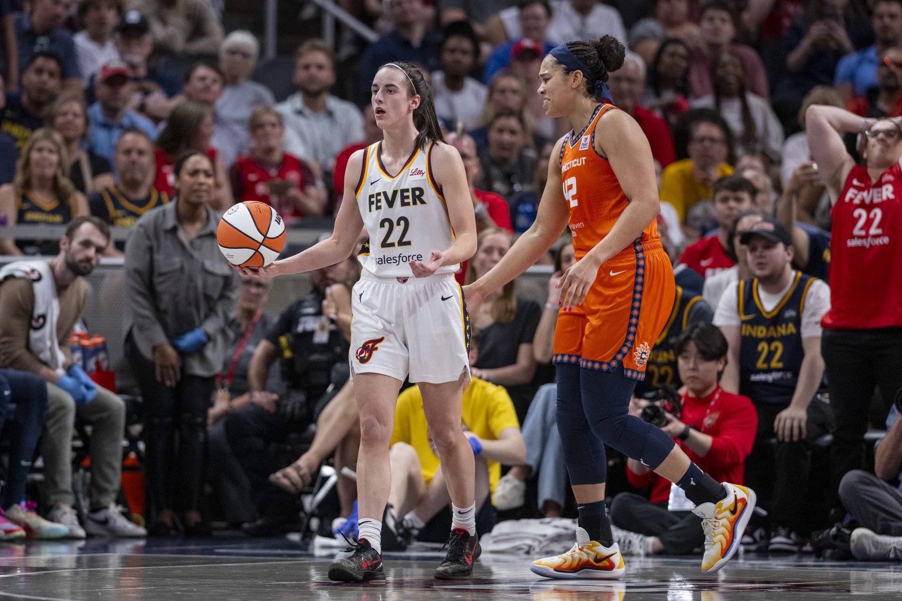 Indiana Fever guard Caitlin Clark (22) reacts after being called for a foul during the second half of an WNBA basketball game against the Connecticut Sun, Monday, May 20, 2024, at Gainbridge Fieldhouse.