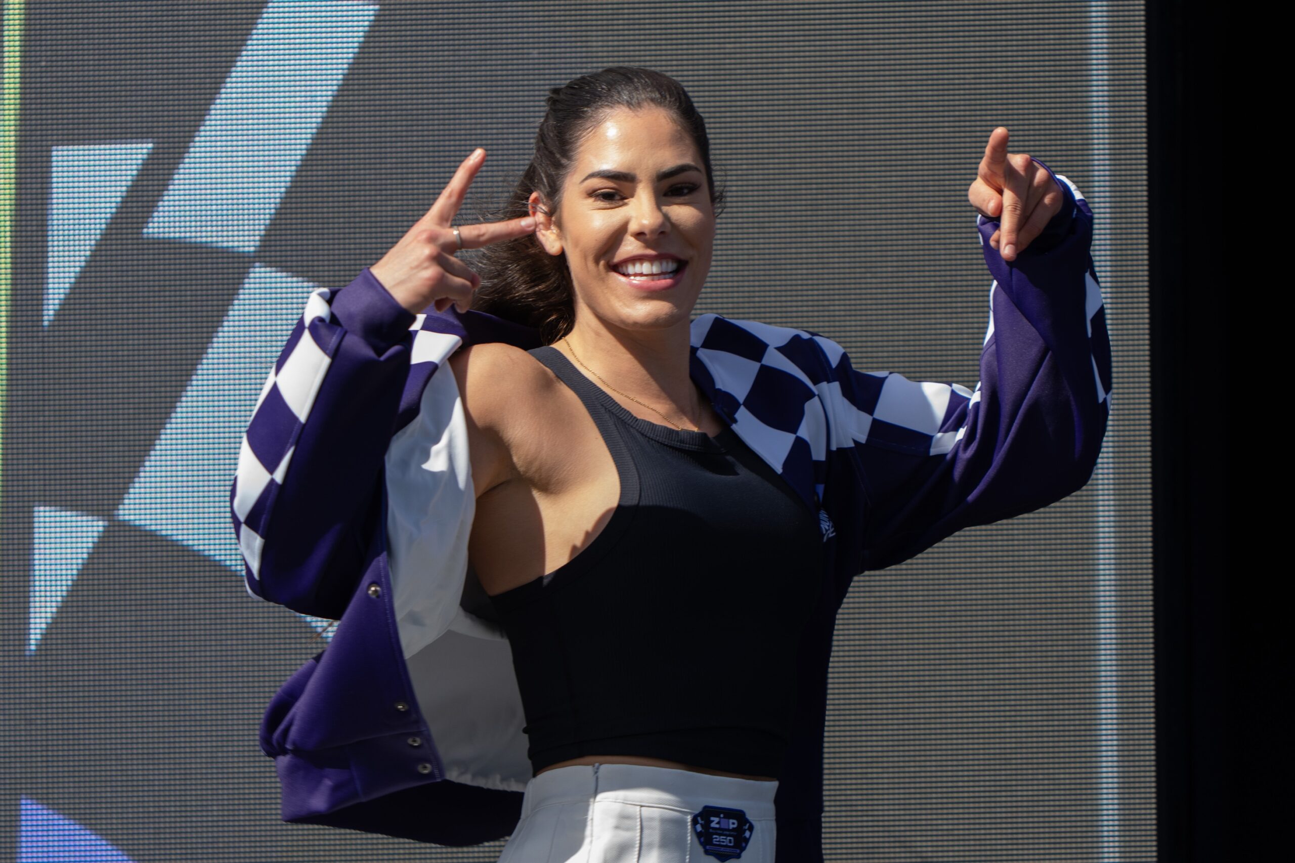 Jun 8, 2024; Sonoma, California, USA;  Las Vegas Aces point guard Kelsey Plum (10) waves at fans as she was introduced as the Grand Marshall of the NASCAR Xfinity Sonoma 250 at Sonoma Raceway. 