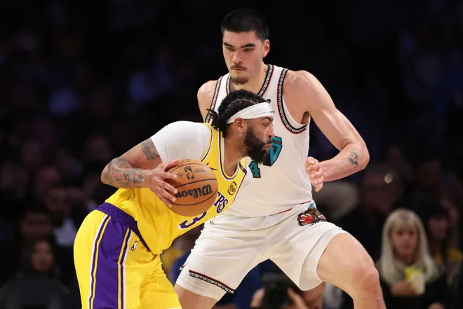Lakers-Grizzlies: Leaked Audio Shows Ja Morant and Anthony Davis' Controversial Trash-Talk 2 LOS ANGELES, CALIFORNIA - NOVEMBER 13: Anthony Davis #3 of the Los Angeles Lakers drives to the basket against Zach Edey #14 of the Memphis Grizzlies during the third quarter at Crypto.com Arena on November 13, 2024 in Los Angeles, California. (Photo by Harry How/Getty Images)