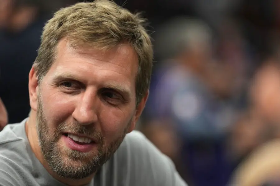 Former Dallas Mavericks player Dirk Nowitzki looks on during the first half of game one of the second round for the 2022 NBA playoffs against the Phoenix Suns at Footprint Center.