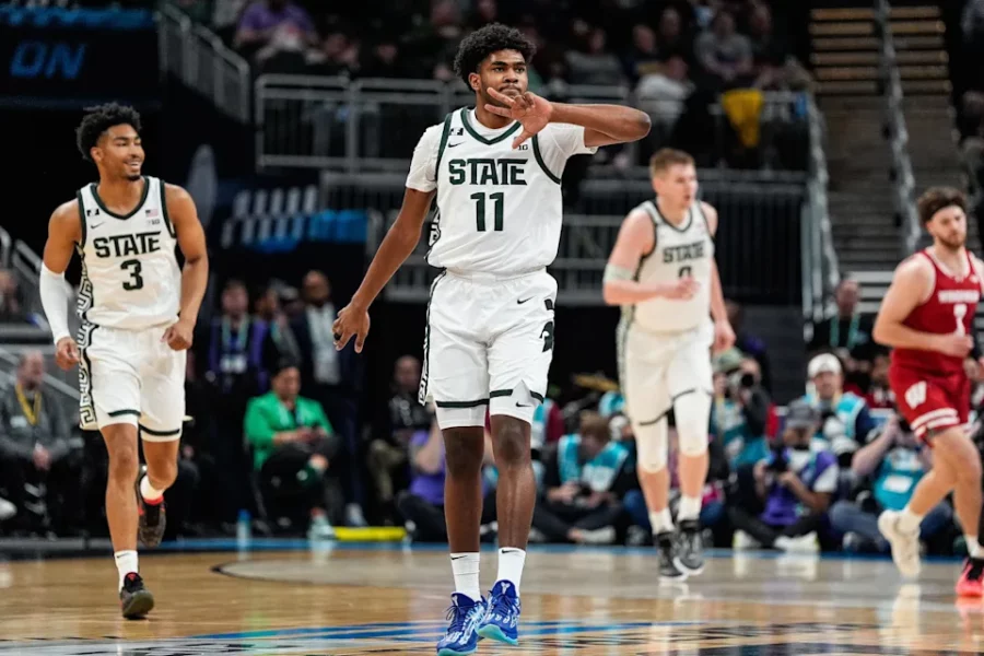 Michigan State guard Jase Richardson (11) celebrates a three point basket against Wisconsin during the first half of Big Ten Tournament semifinal at Gainbridge Fieldhouse in Indianapolis, Ind. on Saturday, March 15, 2025.