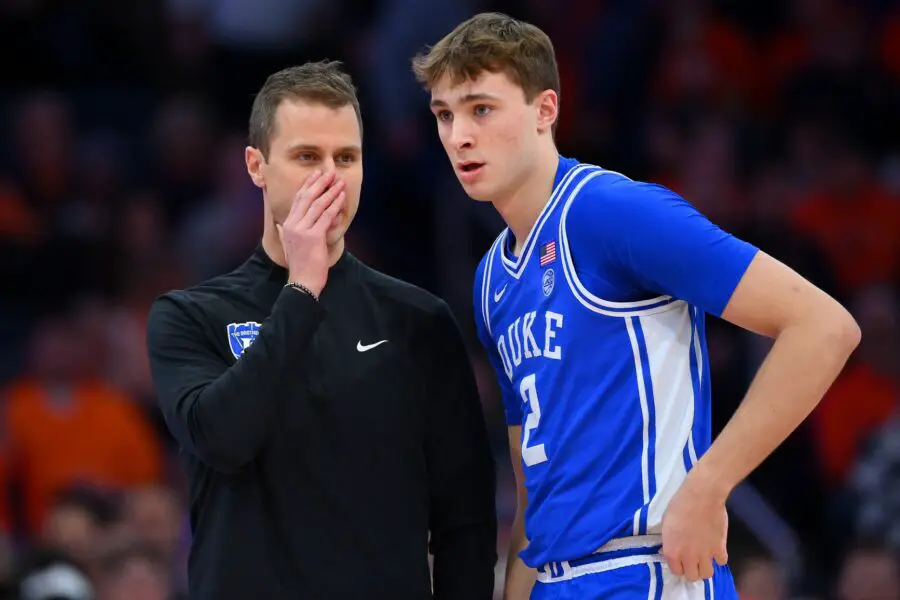 Duke Blue Devils head coach Jon Scheyer talks with guard Cooper Flagg (2) against the Syracuse Orange during the first half at the JMA Wireless Dome. 