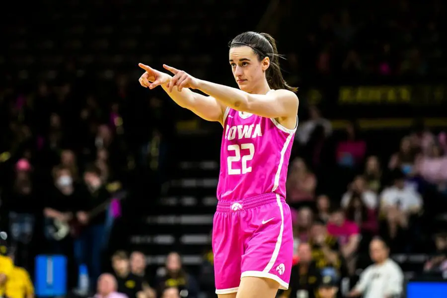 Iowa guard Caitlin Clark (22) points to a teammate while checking into the game during a NCAA Big Ten Conference women's basketball game 