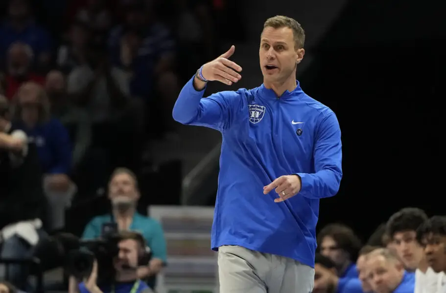 Duke Blue Devils head coach Jon Scheyer in the first half of the 2025 ACC Conference Championship game against the Louisville Cardinals at Spectrum Center.