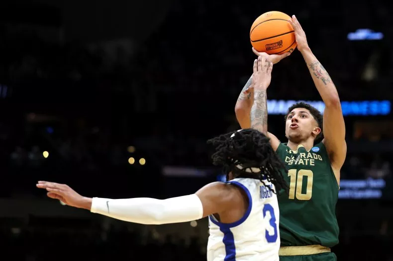 Nique Clifford #10 of the Colorado State Rams shoots the ball against Colby Rogers #3 of the Memphis Tigers during the second half in the first round of the NCAA Men's Basketball Tournament. Steph Chambers/Getty Images
