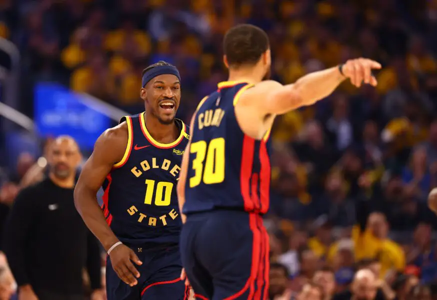 Golden State Warriors forward Jimmy Butler III (10) celebrates towards guard Stephen Curry (30) after a basket against the Houston Rockets during the first quarter of game four of the 2025 NBA Playoffs first round at Chase Center.