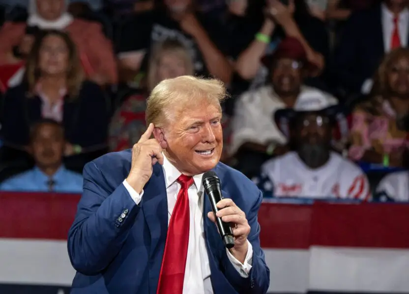Former president Donald Trump talks about the assassination attempt on him as he speaks to an audience during a town hall meeting at Dort Financial Center in Flint, Michigan on Tuesday, September 17, 2024.