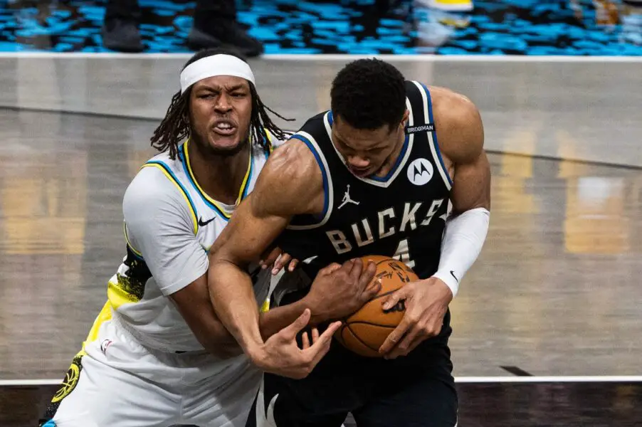 Apr 29, 2025; Indianapolis, Indiana, USA; Indiana Pacers center Myles Turner (33) and Milwaukee Bucks forward Giannis Antetokounmpo (34) fight for the ball  during game five of the first round for the 2024 NBA Playoffs at Gainbridge Fieldhouse. Mandatory Credit: Trevor Ruszkowski-Imagn Images