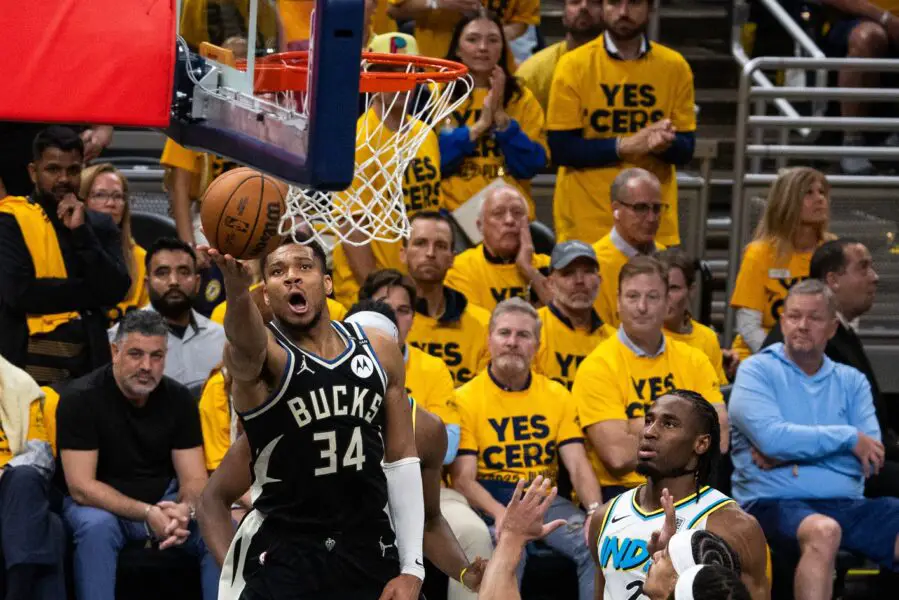 Apr 29, 2025; Indianapolis, Indiana, USA; Milwaukee Bucks forward Giannis Antetokounmpo (34) shoots the ball while  Indiana Pacers guard Andrew Nembhard (2) defends during game five of the first round for the 2024 NBA Playoffs at Gainbridge Fieldhouse. Mandatory Credit: Trevor Ruszkowski-Imagn Images