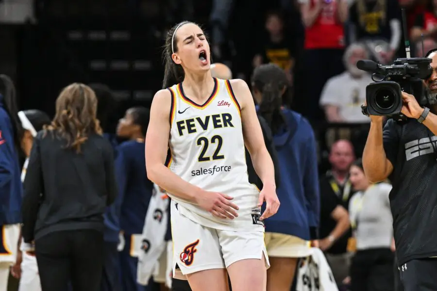 'I Got It': Caitlin Clark Offers To Pay Teammate's 'Hefty' WNBA Fine For Pushing Angel Reese 2 Indiana Fever guard Caitlin Clark (22) reacts during the third quarter against the Brazil National Team at Carver-Haweye Arena.