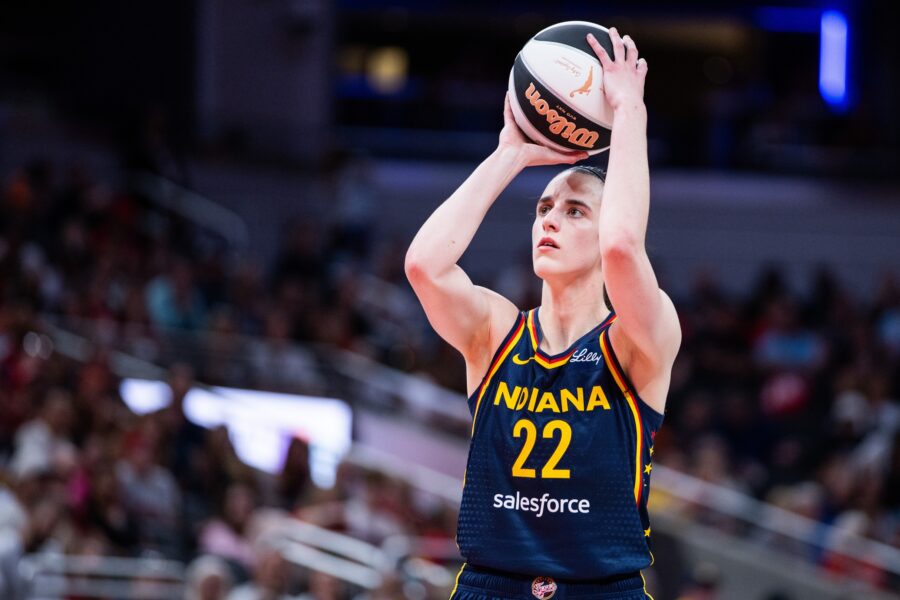 Jun 17, 2025; Indianapolis, Indiana, USA; Indiana Fever guard Caitlin Clark (22) shoots the ball in the first half against the Connecticut Sun at Gainbridge Fieldhouse. Mandatory Credit: Trevor Ruszkowski-Imagn Images