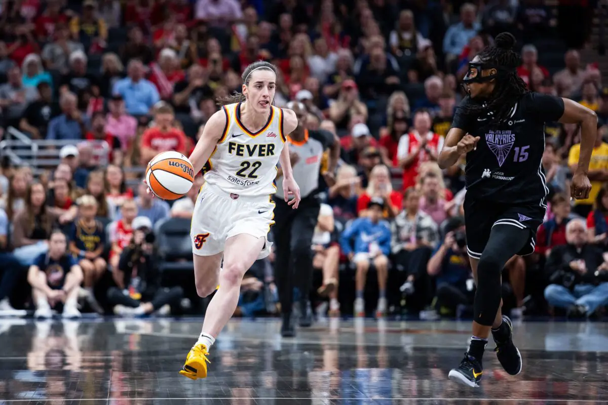 "CC And PB Are In Different Solar Systems": Caitlin Clark Outshines Paige Bueckers As Christine Brennan Slams Wings Rookie’s Arena Draw 3 Jul 9, 2025; Indianapolis, Indiana, USA; Indiana Fever guard Caitlin Clark (22) dribbles the ball while Golden State Valkyries guard Tiffany Hayes (15) defends in the first half at Gainbridge Fieldhouse. Mandatory Credit: Trevor Ruszkowski-Imagn Images