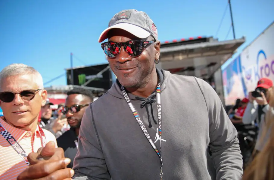 Feb 20, 2022; Daytona Beach, Florida, USA; Michael Jordan greets crew members of NASCAR Cup Series driver Bubba Wallace (23) at Daytona International Speedway. Mandatory Credit: Matt Stamey-USA TODAY Sports