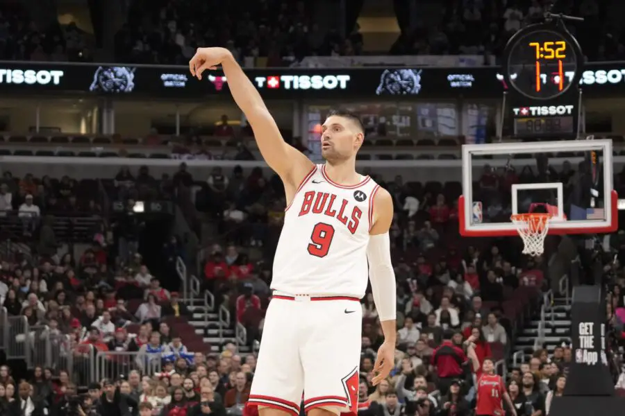Dec 26, 2025; Chicago, Illinois, USA; Chicago Bulls center Nikola Vucevic (9) makes a three point basket against the Philadelphia 76ers during the first half at United Center. Mandatory Credit: David Banks-Imagn Images