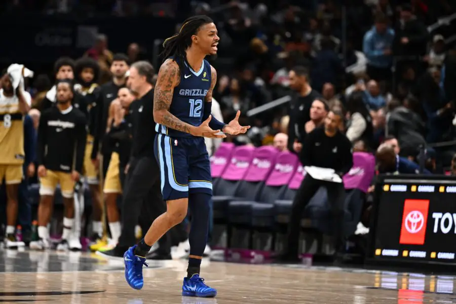Dec 28, 2025; Washington, District of Columbia, USA; Memphis Grizzlies guard Ja Morant (12) reacts after a three point shot against the Washington Wizards during the second half at Capital One Arena. Mandatory Credit: Brad Mills-Imagn Images