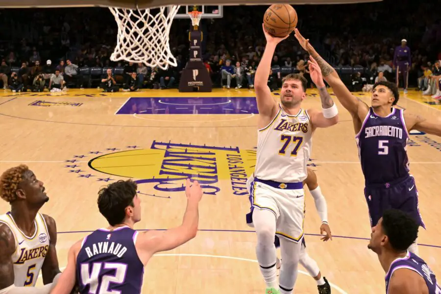 Dec 28, 2025; Los Angeles, California, USA; Los Angeles Lakers guard Luka Doncic (77) is defended by Sacramento Kings guard Nique Clifford (5) in the second half at Crypto.com Arena. Mandatory Credit: Jayne Kamin-Oncea-Imagn ImagesLuka Dončić