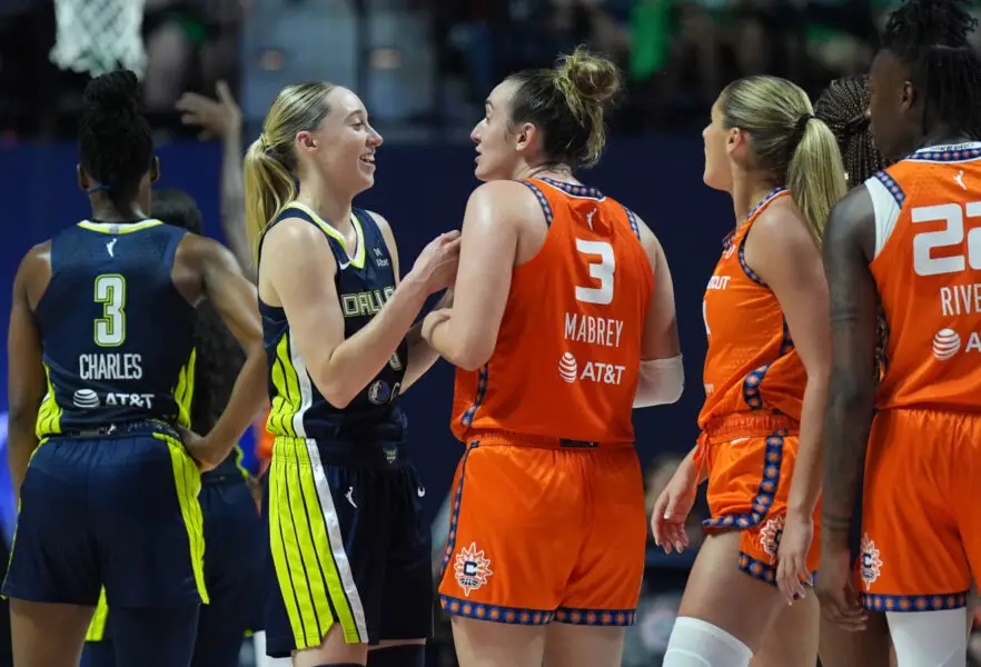 Dallas Wings guard Paige Bueckers talks with Connecticut Sun guard Marina Mabrey Mandatory Credit: David Butler II-Imagn Images