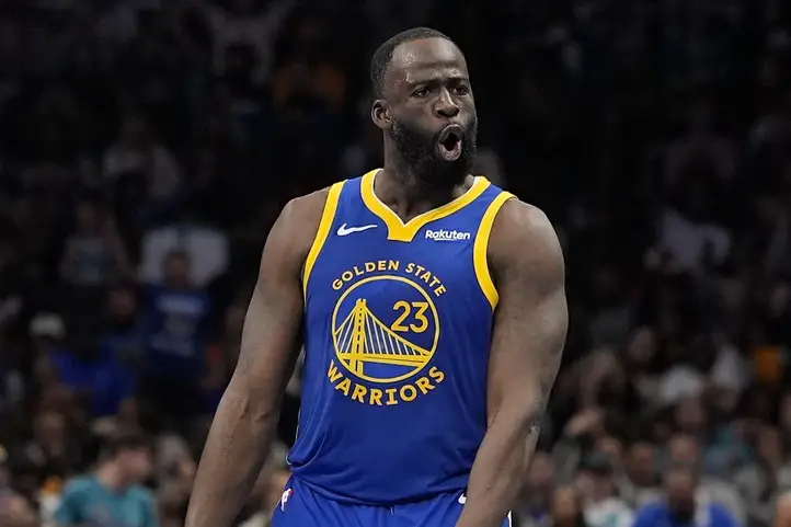 Dec 31, 2025; Charlotte, North Carolina, USA; Golden State Warriors forward Draymond Green (23) reacts to his three point basket during the second half against the Charlotte Hornets at Spectrum Center. Mandatory Credit: Jim Dedmon-Imagn Images