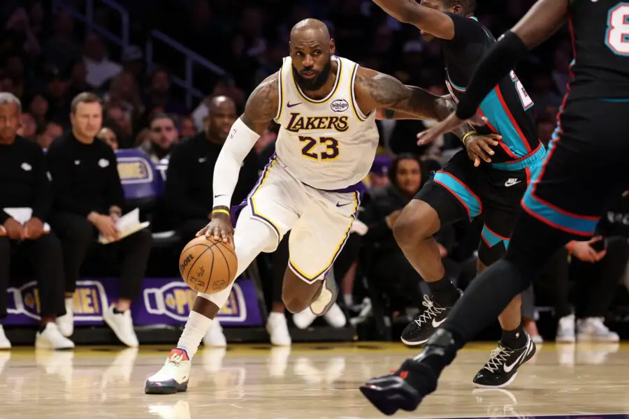 Jan 4, 2026; Los Angeles, California, USA; Los Angeles Lakers forward LeBron James (23) dribbles the ball during the first quarter against the Memphis Grizzlies at Crypto.com Arena. Mandatory Credit: Kiyoshi Mio-Imagn Images