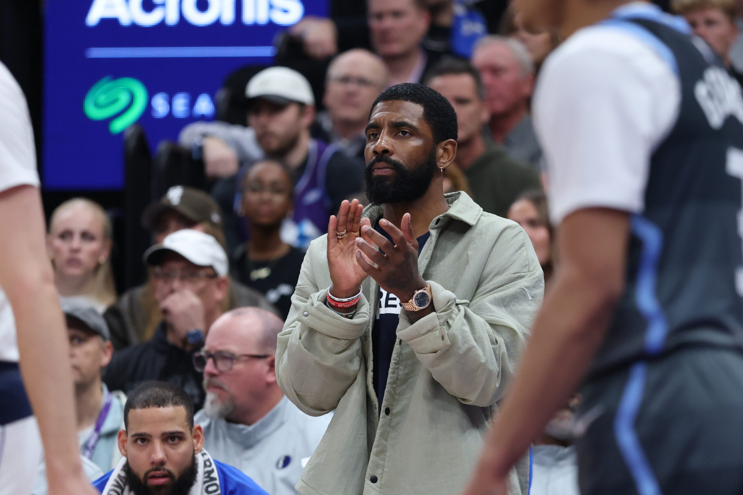 Kyrie Irving reacts on the sideline during Dallas Mavericks game